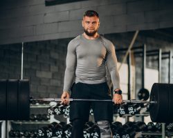 Strong man exercising at the gym